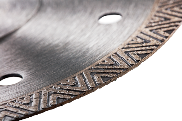 Close-up of a construction saw blade with intricate detailing.