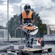 Construction worker sawing stone with K 1 Pace