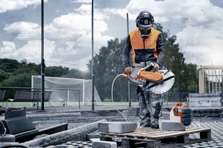 Construction worker sawing stone with K 1 Pace