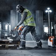 Construction worker sawing stone with K 1 Pace