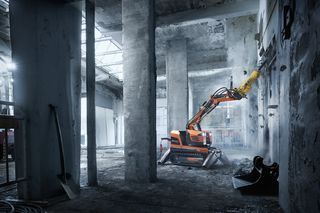 DXR 95 demolishing concrete wall