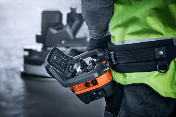 Autogrinder operator with remote control and harness