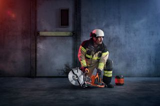 Fire fighter with rescue saw